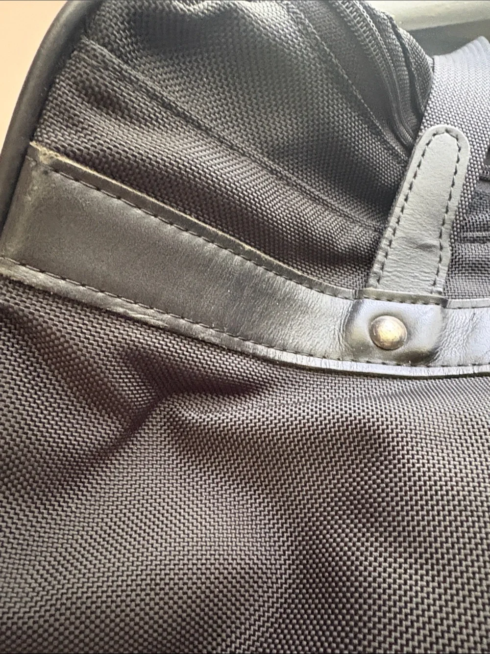 Hartmann zip around nylon and leather duffle style bag.